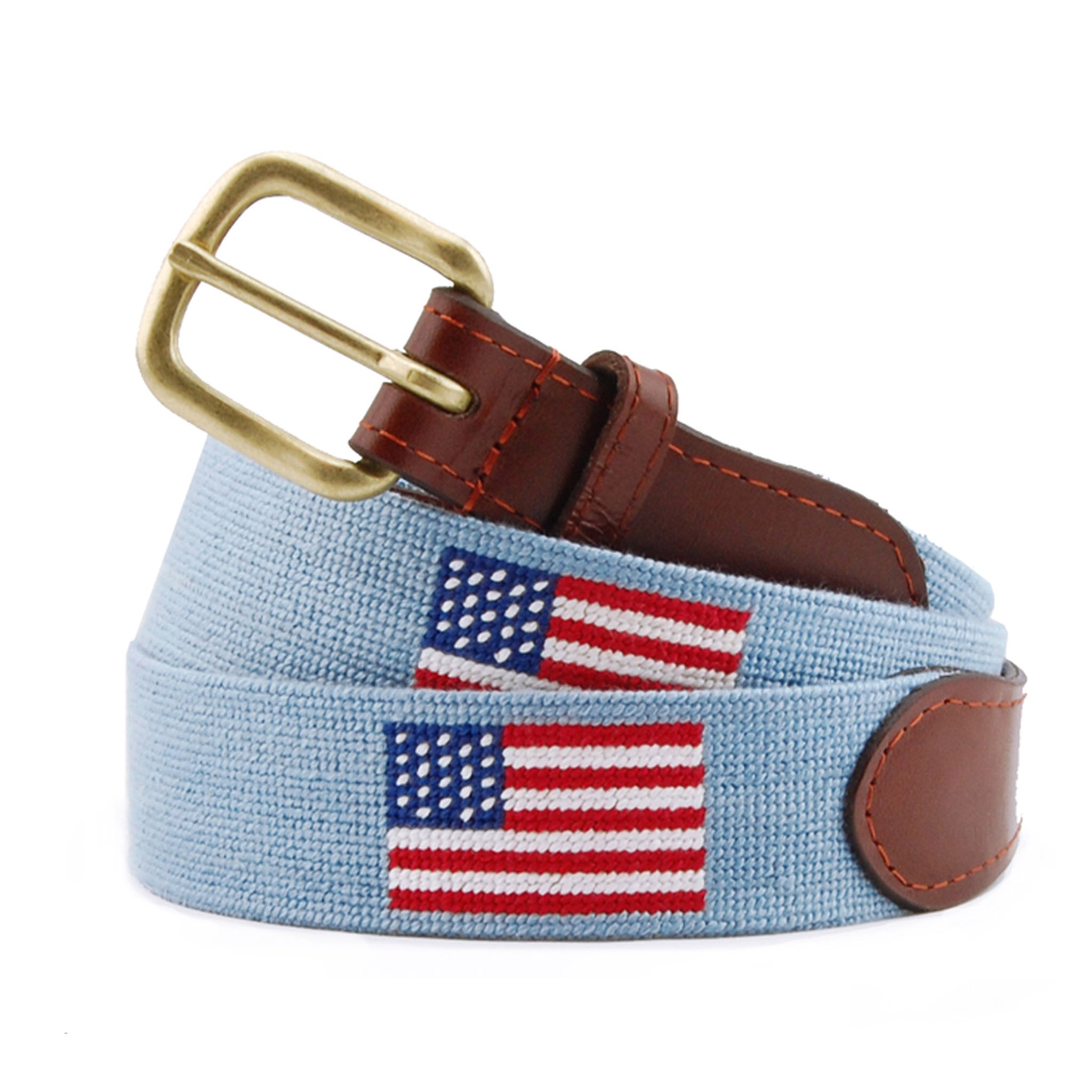 Monogrammed American Flag Needlepoint Belt Antique Blue coiled, with brown leather trim and a brass buckle
