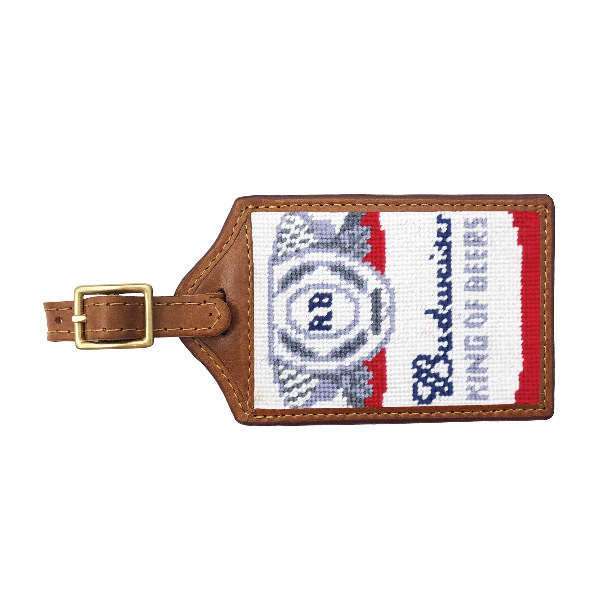 Navy needlepoint luggage tag featuring the Budweiser can label design, brown leather trim, and an ID window on the back.