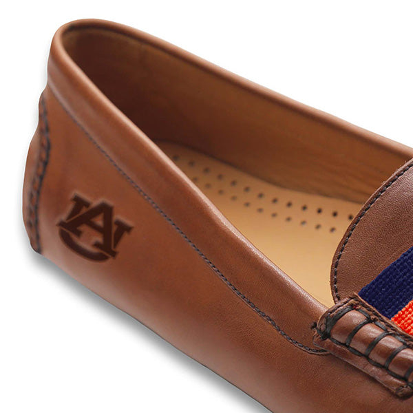 Shows the side view of the driving shoe with detailed needlepoint and leather construction.