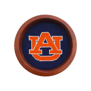 Round wooden wine bottle coaster featuring the Auburn logo stitched in needlepoint.