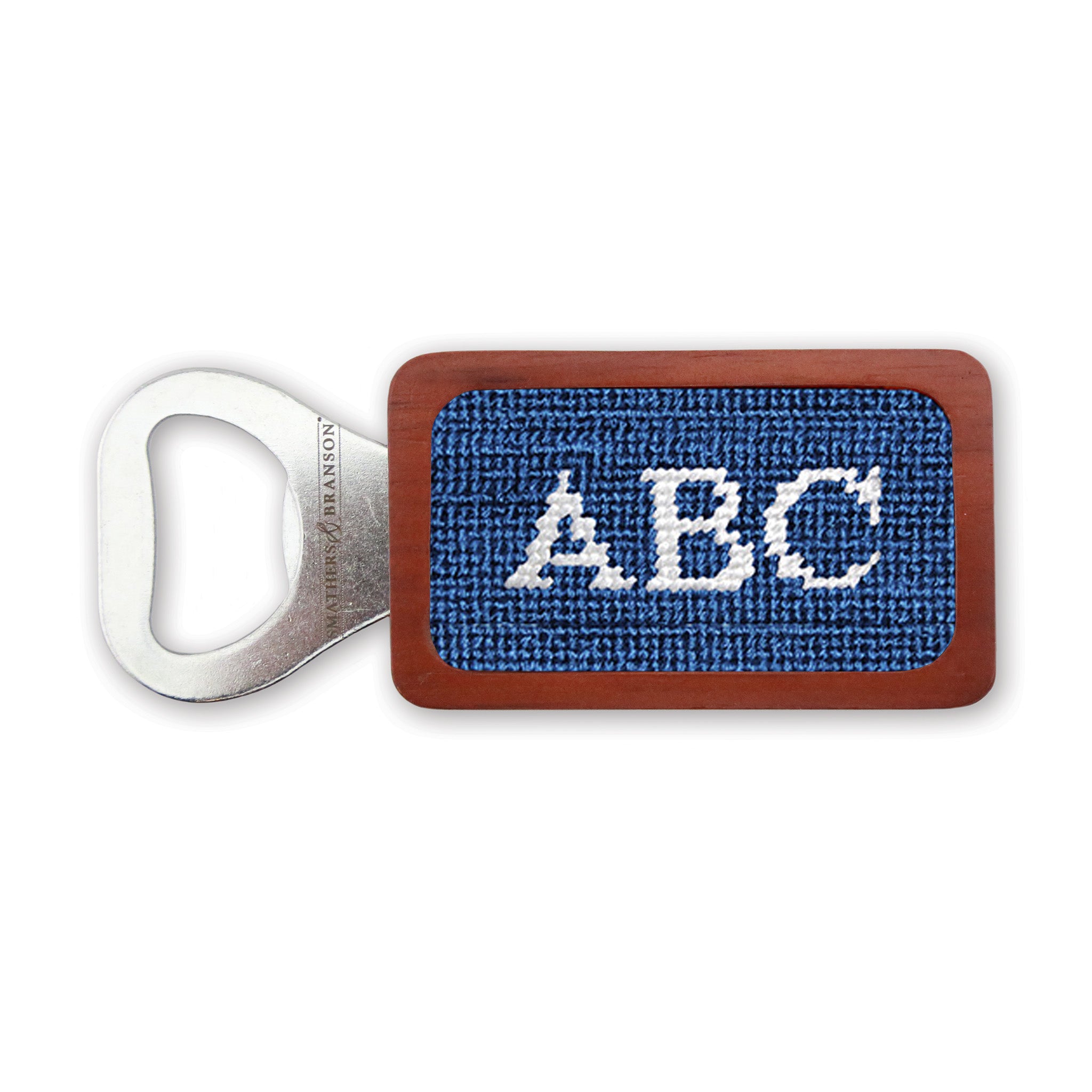 Blueberry needlepoint bottle opener with Block 10 monogram