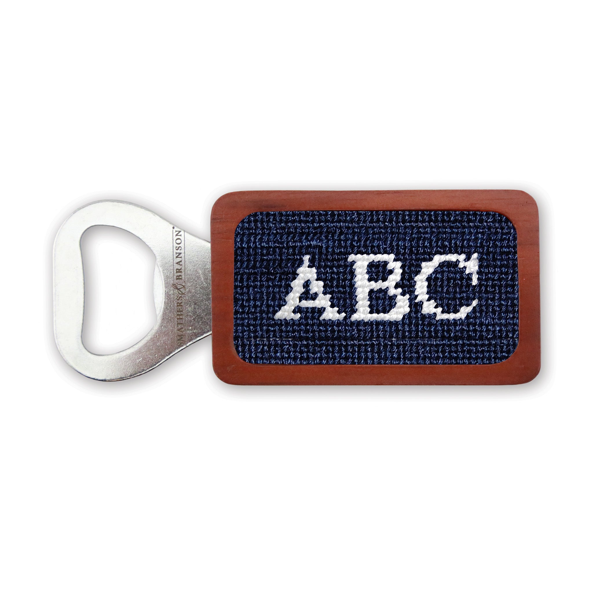Dark navy needlepoint bottle opener with Block 10 monogram