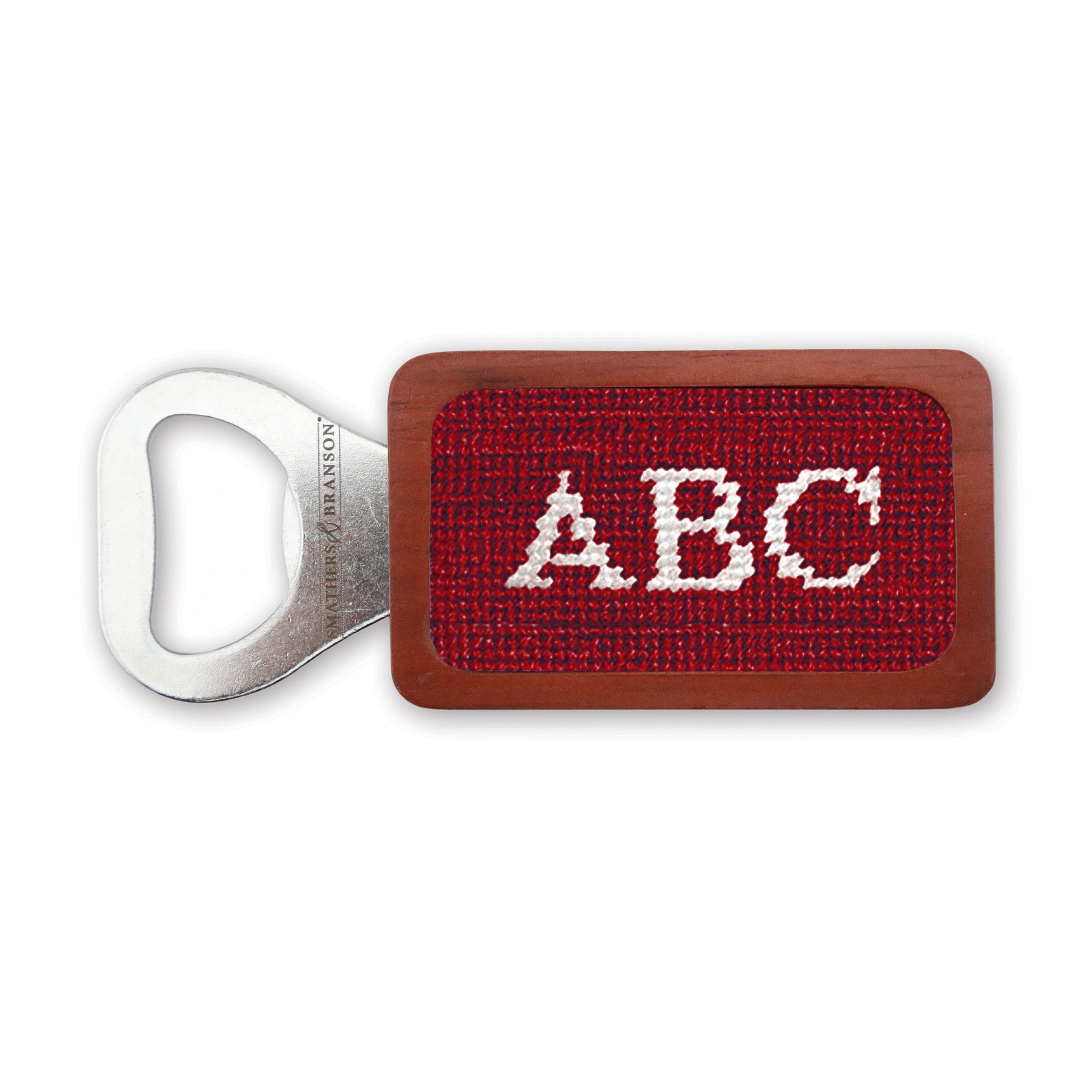 Garnet needlepoint bottle opener with Block 10 monogram