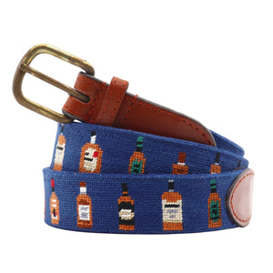 Monogrammed Bourbon Bottles Needlepoint Belt Classic Navy coiled, with brown leather trim and a brass buckle