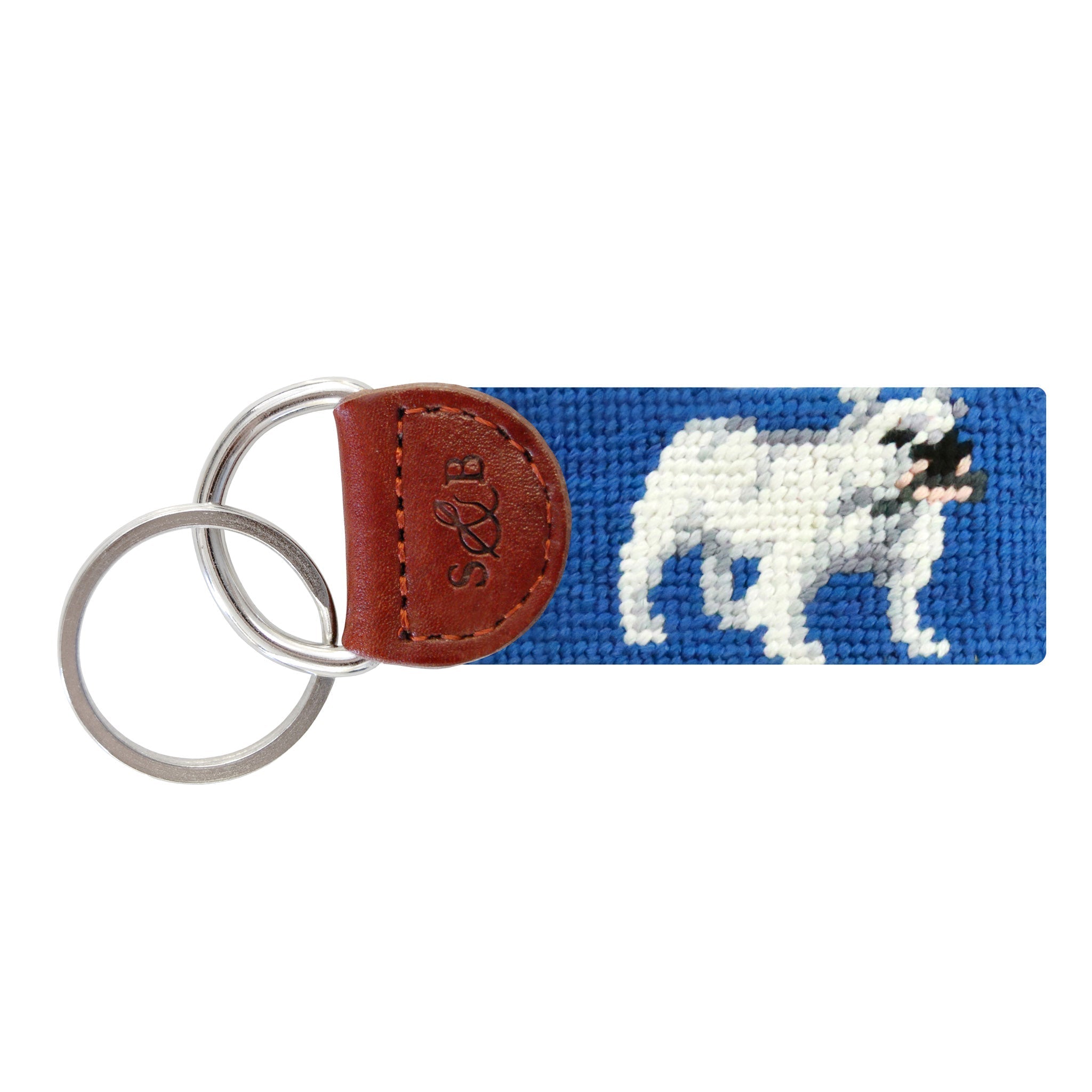 Blueberry needlepoint key fob with a brown and white bulldog face, brown leather trim, and a metal key ring.