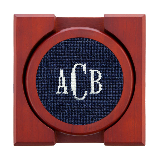 Set of four needlepoint coasters with Classic 24 monogram in dark navy