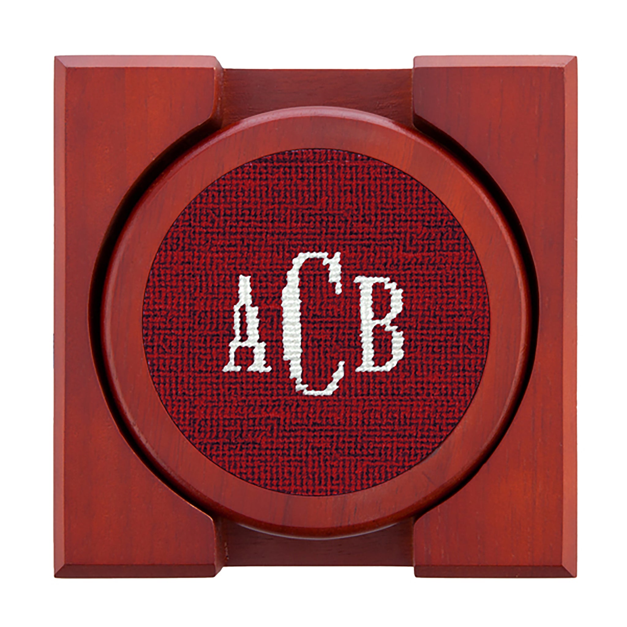 Set of four needlepoint coasters with Classic 24 monogram in garnet
