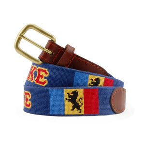 Delta Kappa Epsilon Needlepoint Belt coiled, with brown leather trim and a brass buckle