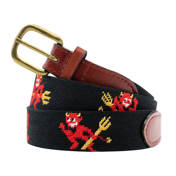 Black belt with red devil designs and a brass buckle on a white background