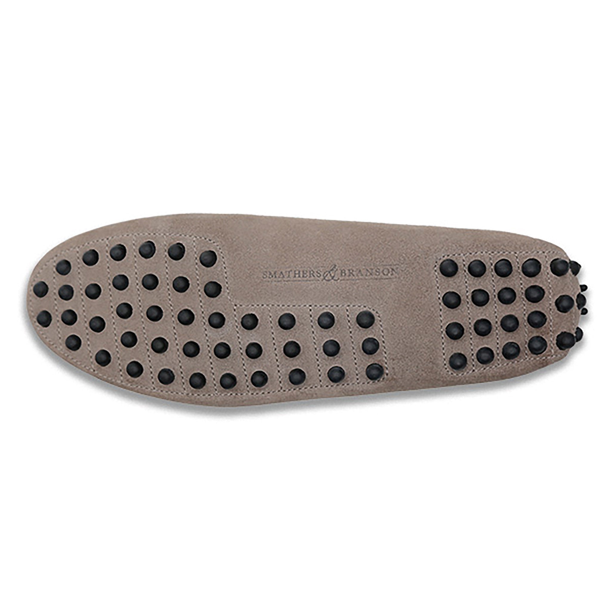Bottom view showing Pebbled rubber sole for traction and durability.