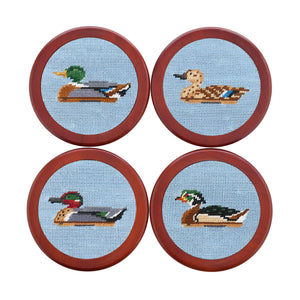 Antique blue coaster featuring a duck decoy stitched pattern, shown laid flat.