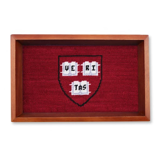 Chestnut wood valet tray with Harvard logo needlepoint stitched design in the base of the tray
