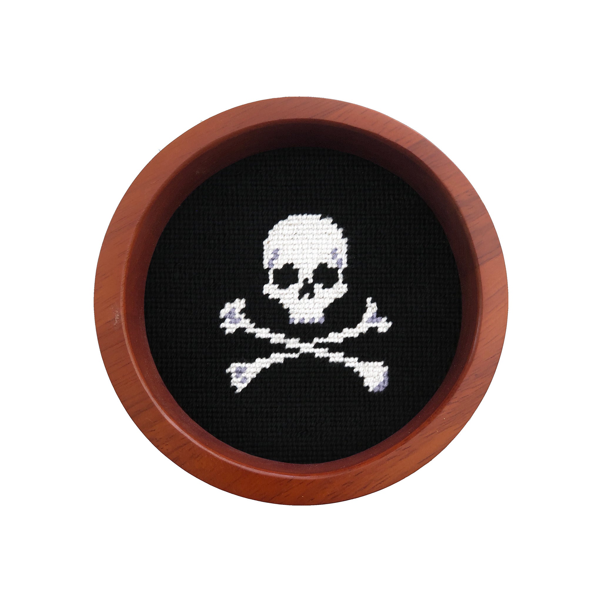 Round wooden wine bottle coaster featuring a Jolly Roger skull and crossbones needlepoint design.