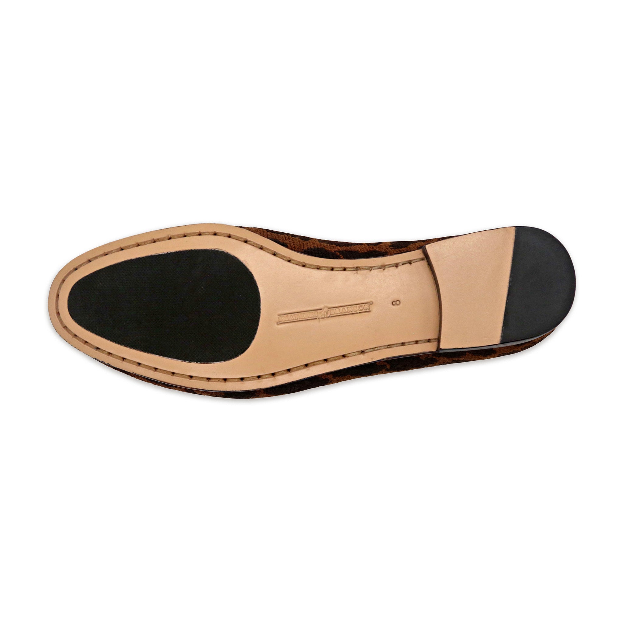 Bottom view showing leather sole with rubber inlet for traction.