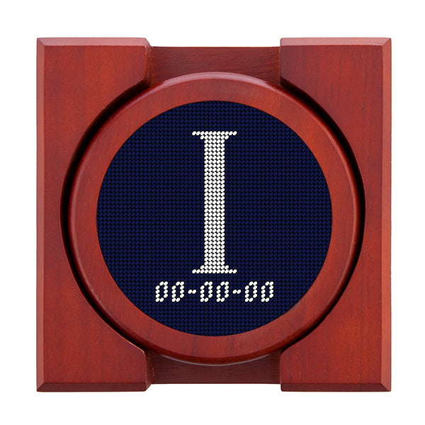 Dark Navy needlepoint coaster set featuring a white large embroidered letter above a custom date, framed with chestnut wood