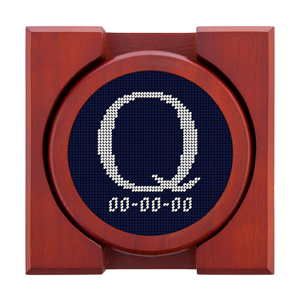 Dark Navy needlepoint coaster set featuring a white large embroidered letter above a custom date, framed with chestnut wood