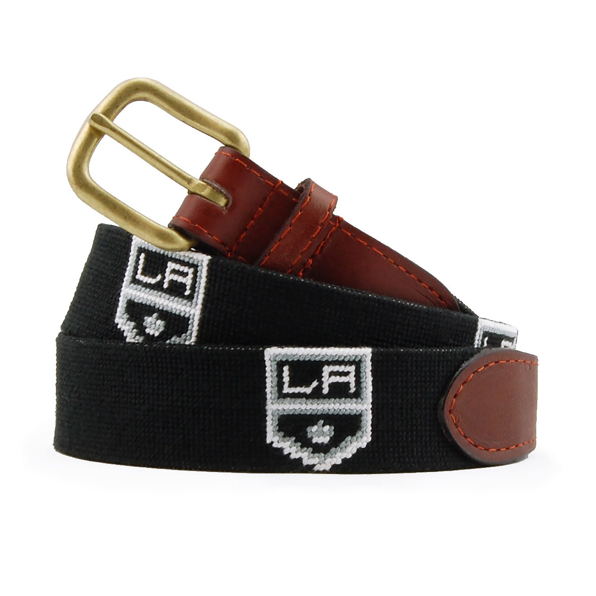 LA Kings Needlepoint Belt Black Final Sale coiled, with brown leather trim and a brass buckle