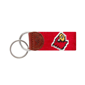 Red needlepoint key fob with the Cardinals head logo, brown leather trim, and a metal key ring.