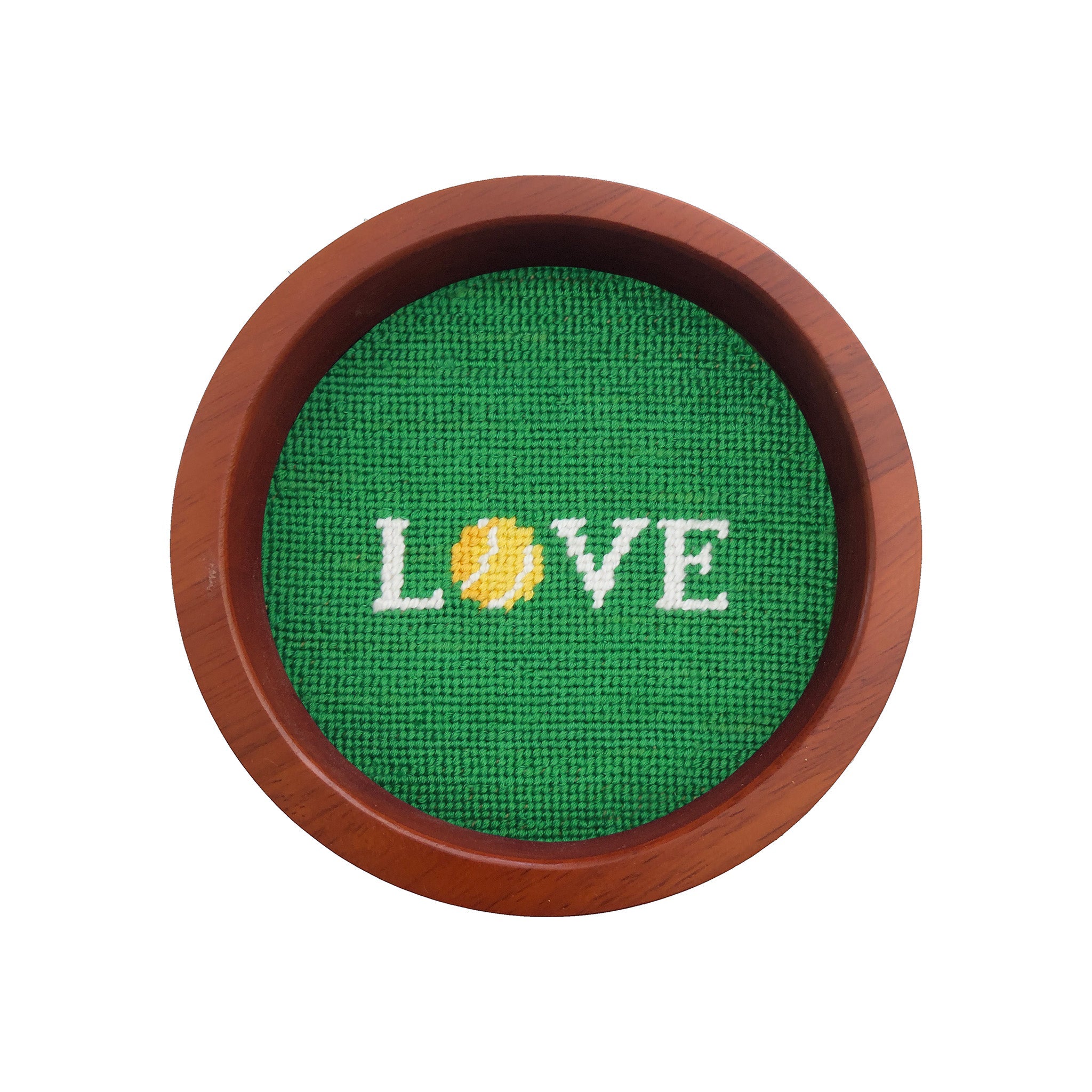 Round wooden wine bottle coaster featuring a “Love All” tennis needlepoint design.