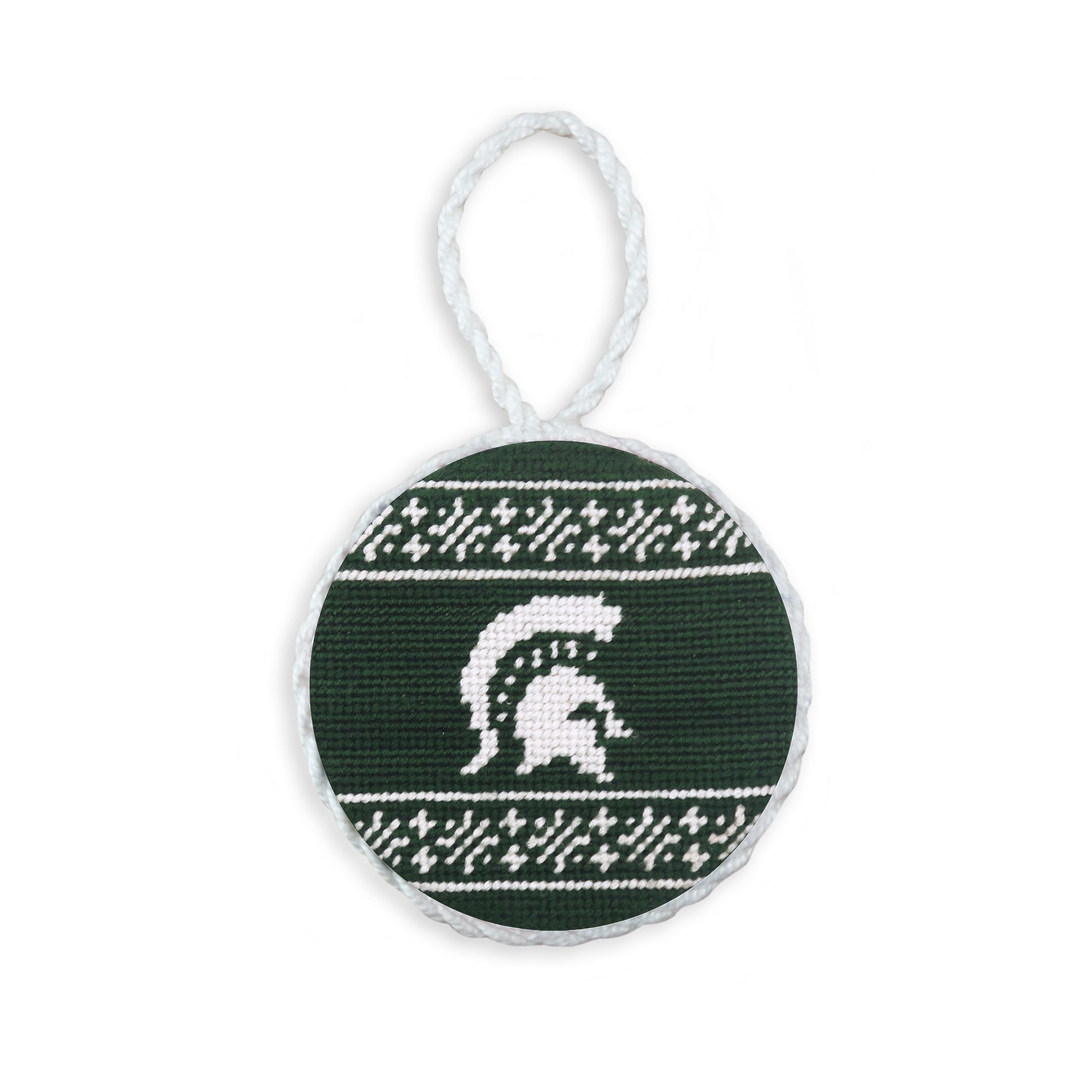 Dark pine needlepoint ornament featuring the Michigan State Spartan logo and a white hanging cord.
