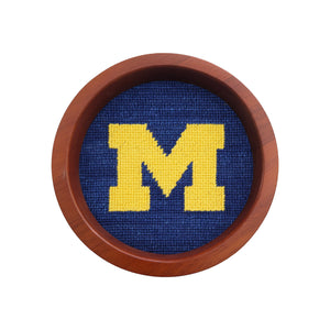 Round wooden wine bottle coaster featuring the Tennessee logo stitched in needlepoint.