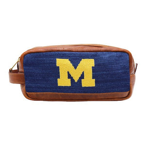 Michigan toiletry bag featuring the Michigan logo with full grain Italian leather trim and zipper closure.
