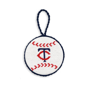 Navy needlepoint ornament featuring the red and white Minnesota Twins “TC” logo, finished with a white hanging cord.