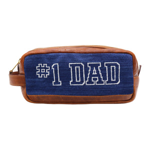 Classic navy toiletry bag featuring the Number One Dad design with full grain Italian leather trim and zipper closure.