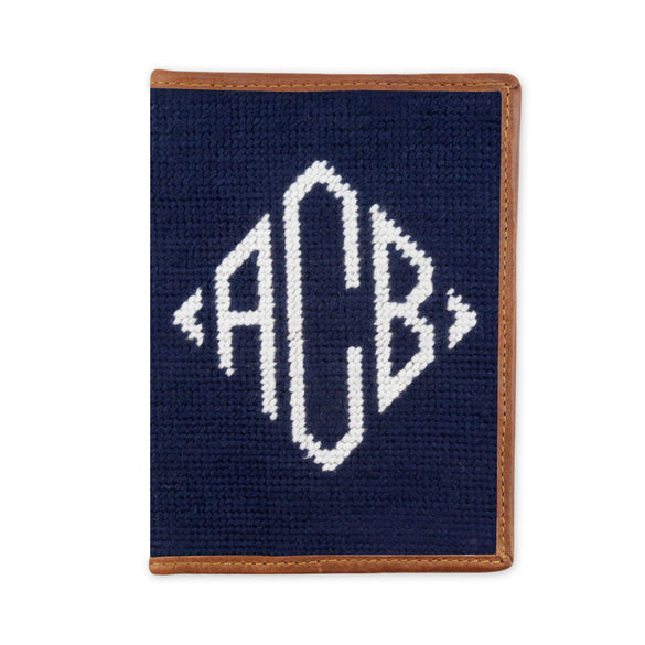 Dark navy monogram needlepoint passport case with diamond pattern and full leather construction