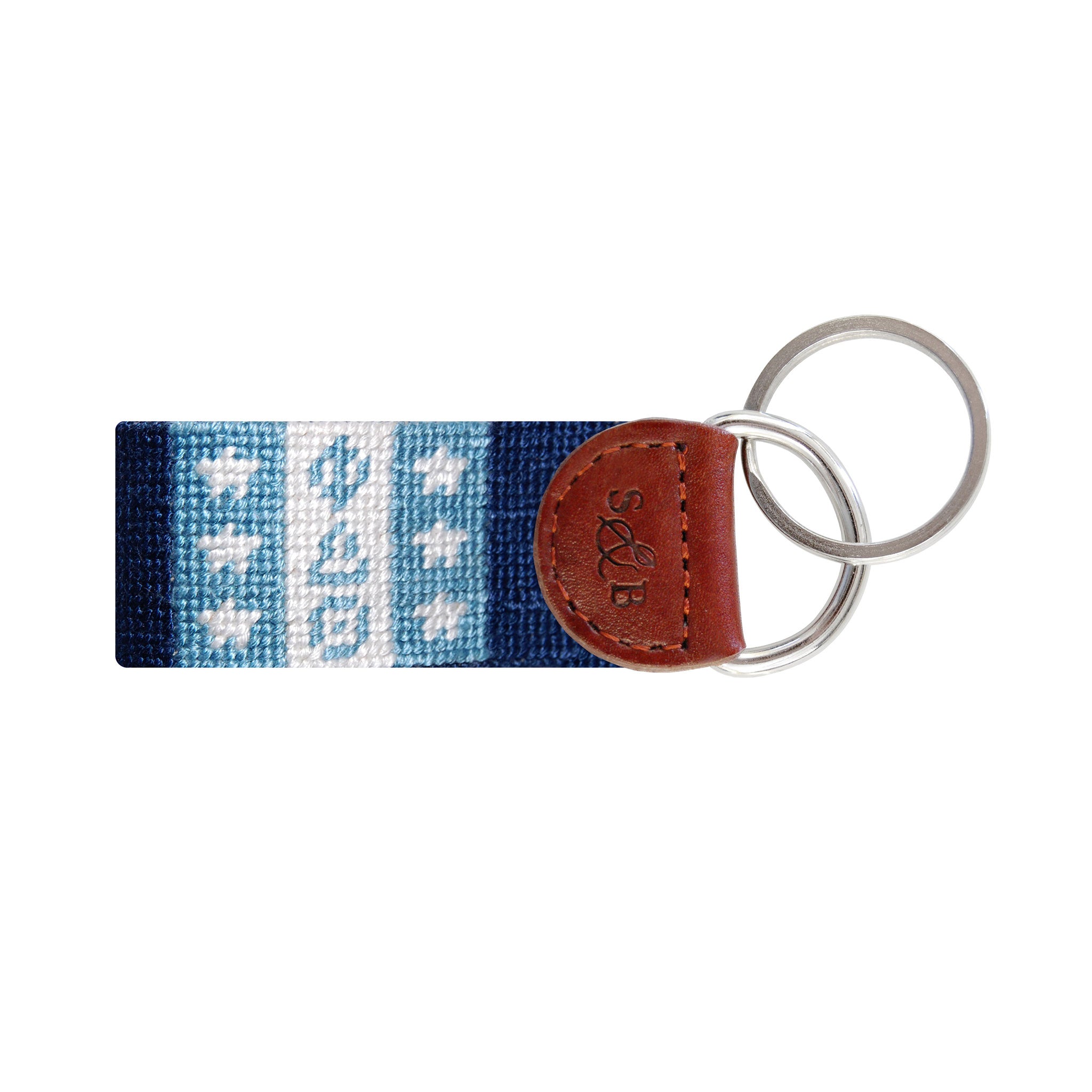 Royal blue needlepoint key fob featuring a sword and white star design for Phi Delta Theta, brown leather trim, and a metal key ring.