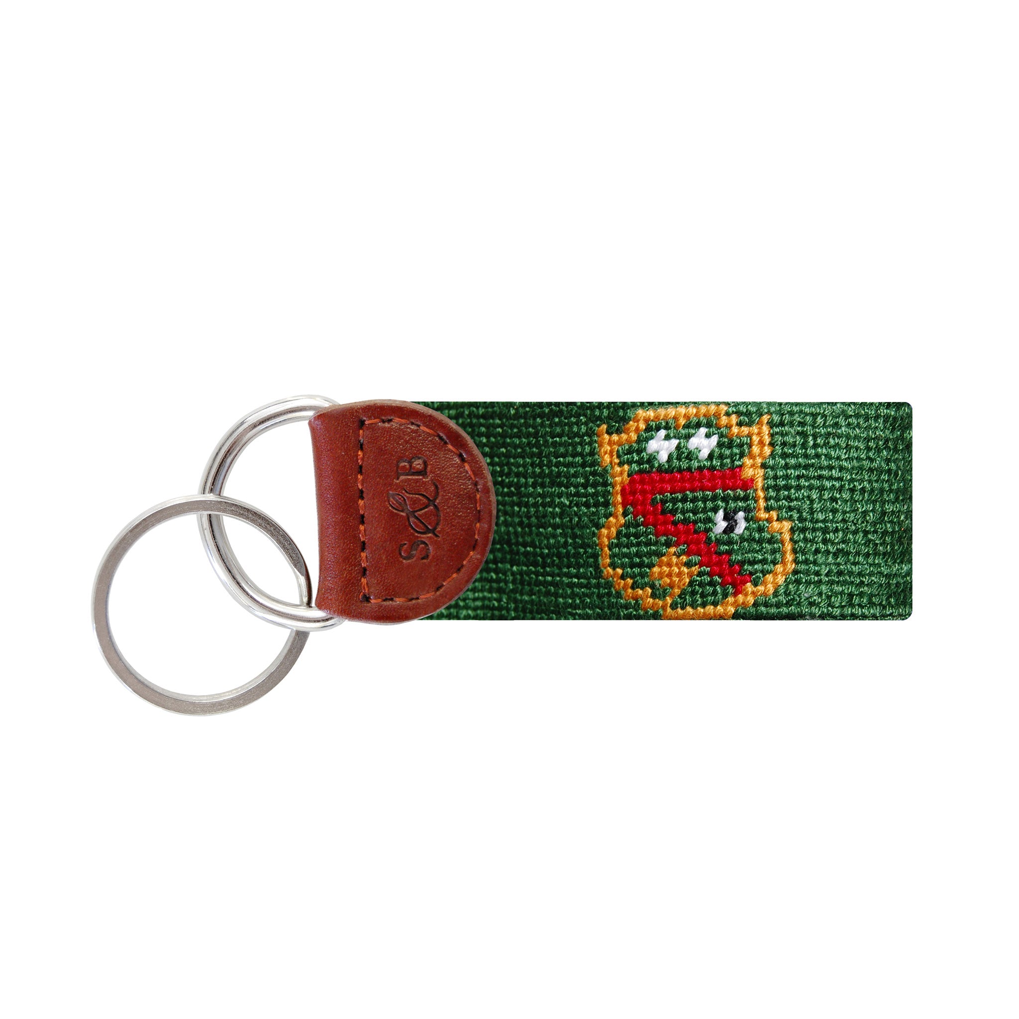 Navy needlepoint key fob displaying the Greek letters ΦΚΨ in white, brown leather trim, and a metal key ring.