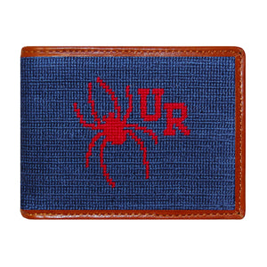 Richmond navy needlepoint bi-fold wallet with yellow “R” logo and brown leather trim, shown from primary angle.