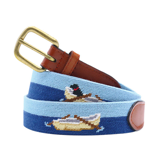 Nautical-themed needlepoint belt with a brass buckle on a white background