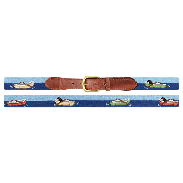 Nautical-themed needlepoint belt with a gold buckle on a white background