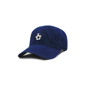 Six-panel cotton hat in blue featuring a stitched black and white soccer ball on the front.
