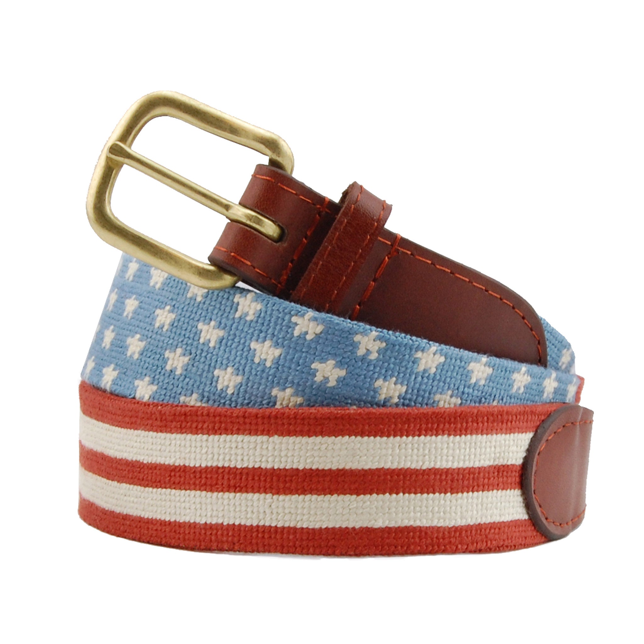 Stars and Stripes Needlepoint Belt coiled, with brown leather trim and a brass buckle