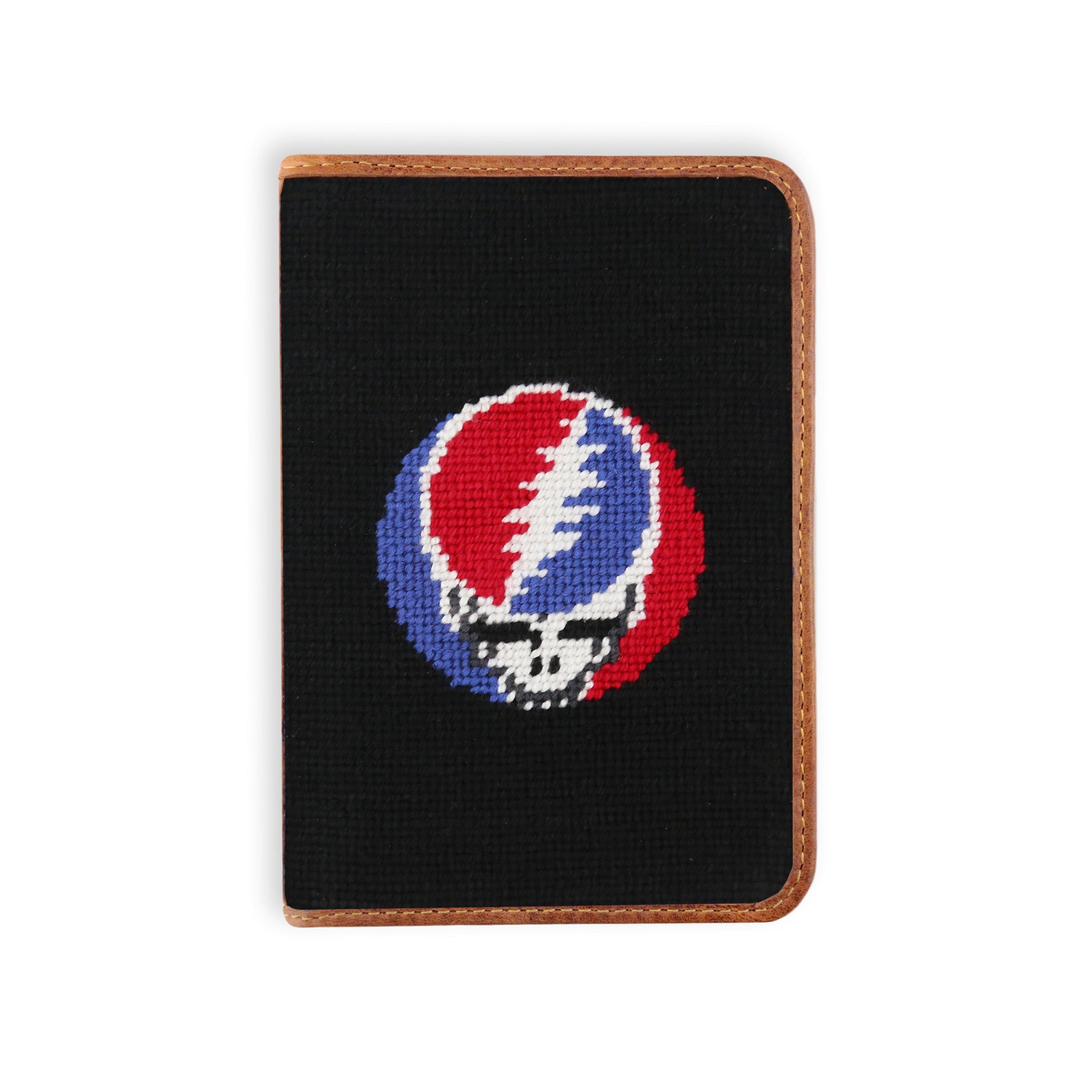 Needlepoint golf scorecard holder featuring a Steal Your Face skull design stitched on black background