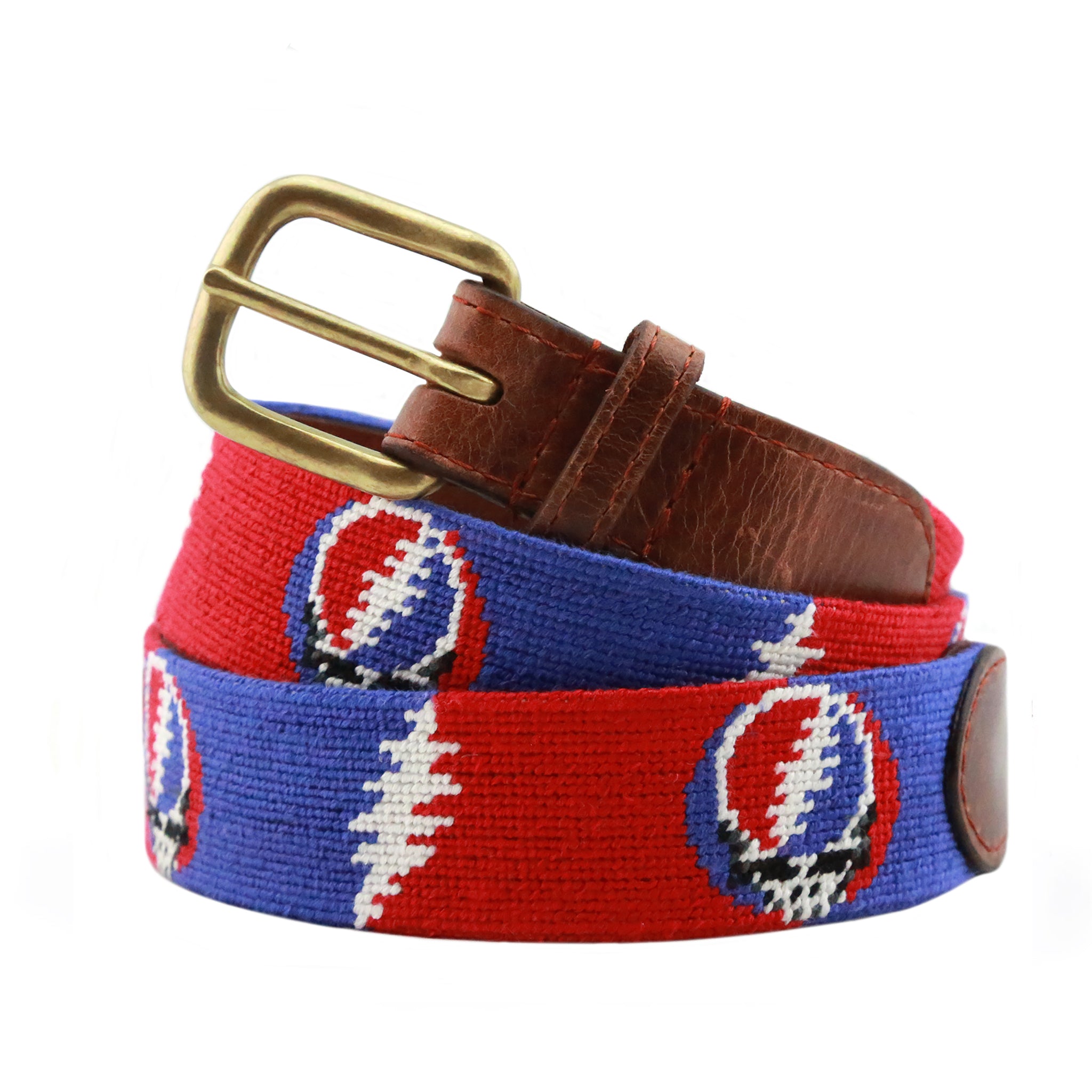 Steal Your Face Bolts Needlepoint Belt coiled, with brown leather trim and a brass buckle