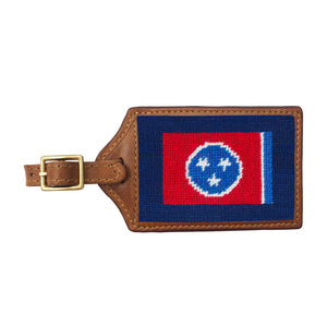 Classic navy needlepoint luggage tag featuring the red Tennessee flag and white star circle, brown leather trim, and an ID window on the back.