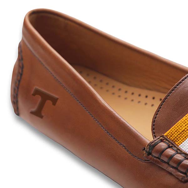 Shows the side view of the driving shoe with detailed needlepoint and leather construction.