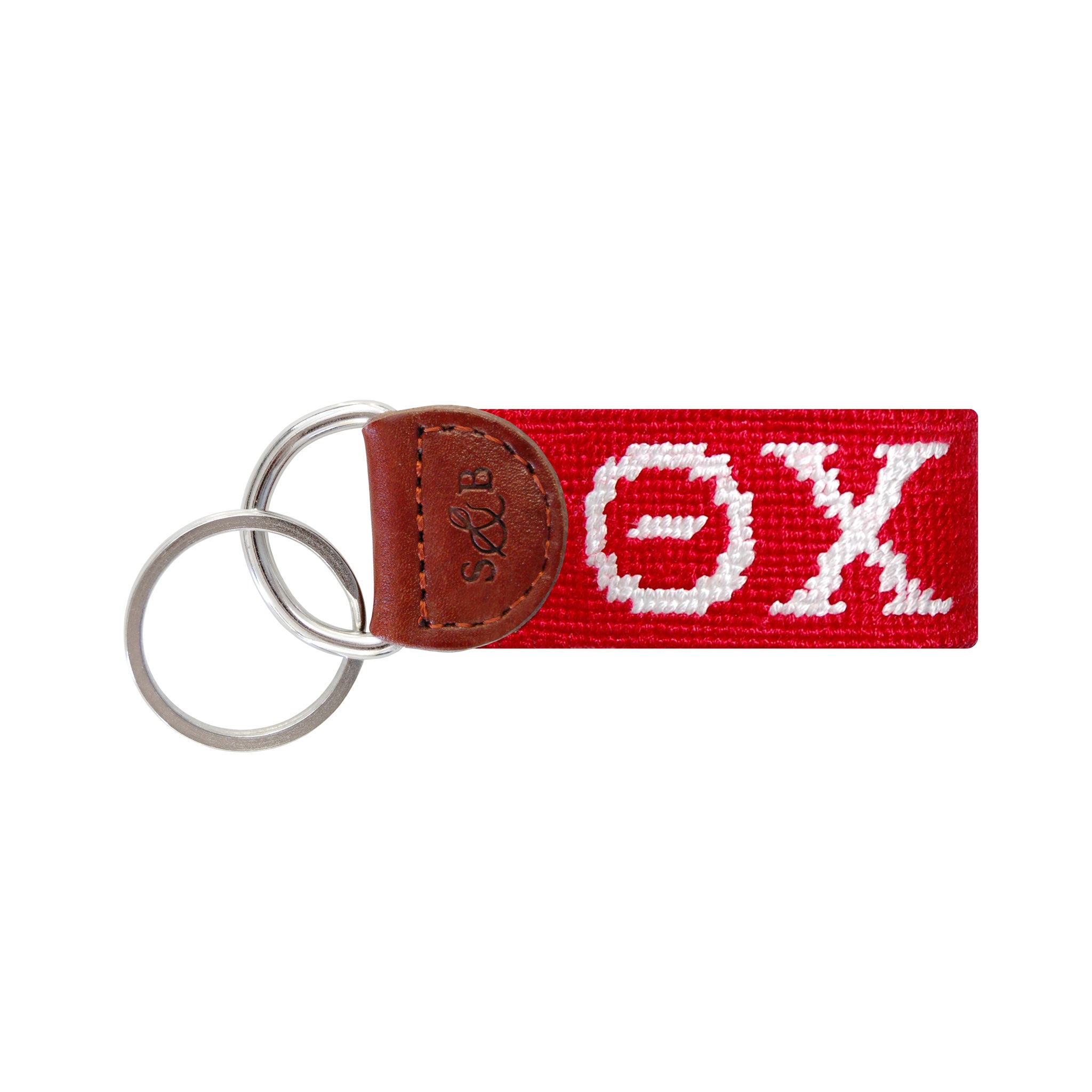 Red needlepoint key fob featuring the Greek letters ΘΧ in white, brown leather trim, and a metal key ring.