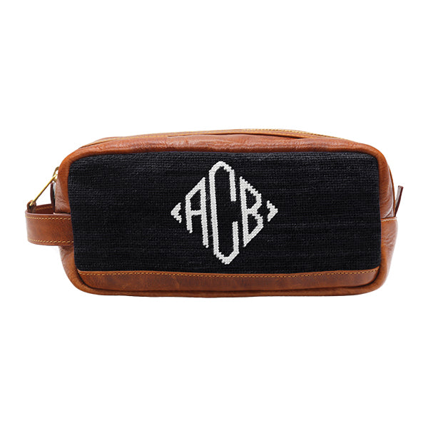 Blueberry toiletry bag with diamond monogram pattern and full grain Italian leather trim.