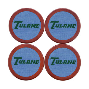 Tulane coaster set featuring the collegiate logo in baby blue and white needlepoint, shown laid flat.