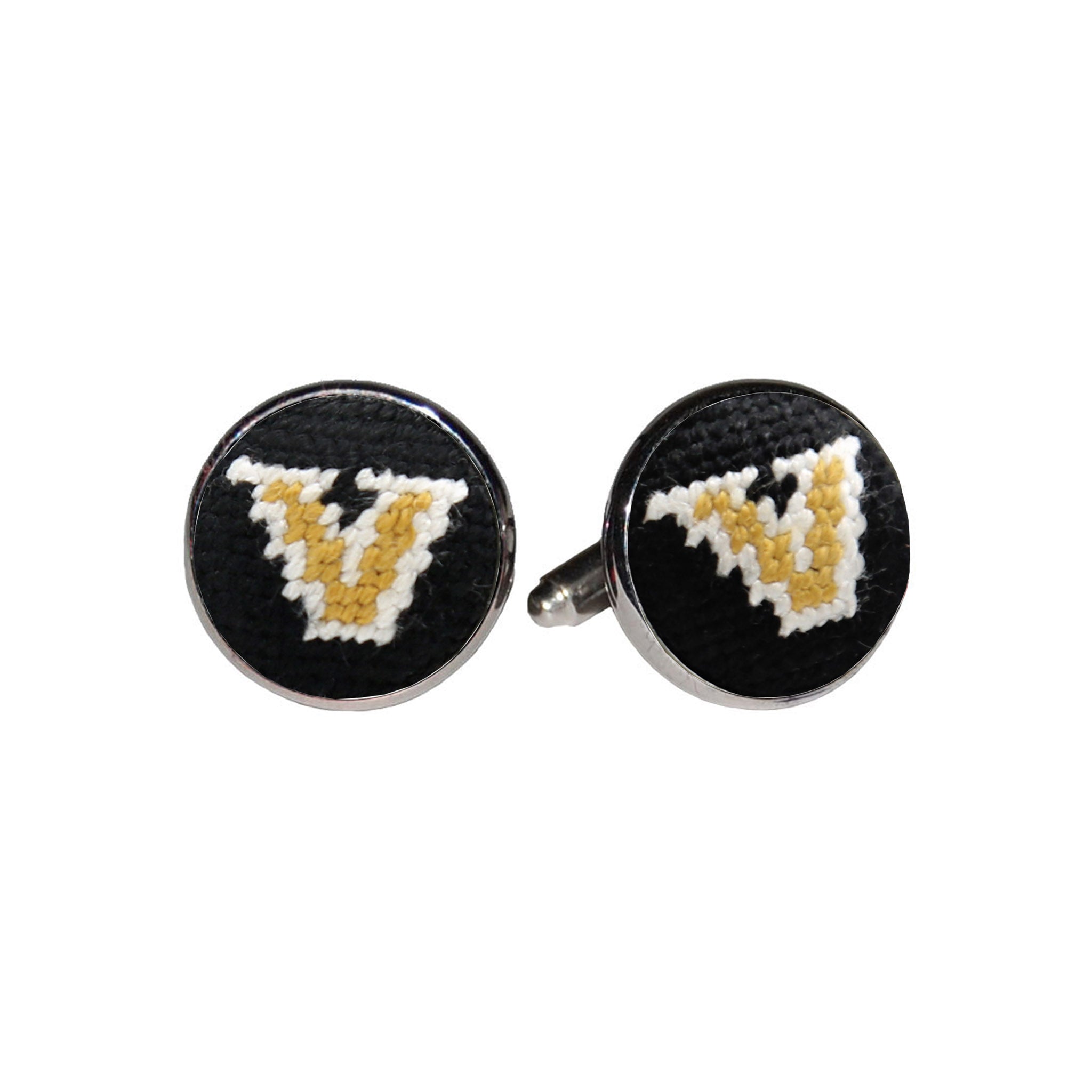 Vanderbilt cufflinks with the black and gold collegiate star logo stitched in needlepoint, set into a silver-plated cufflink.