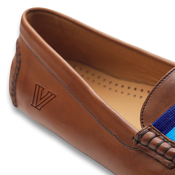 Shows the side view of the driving shoe with detailed needlepoint and leather construction.