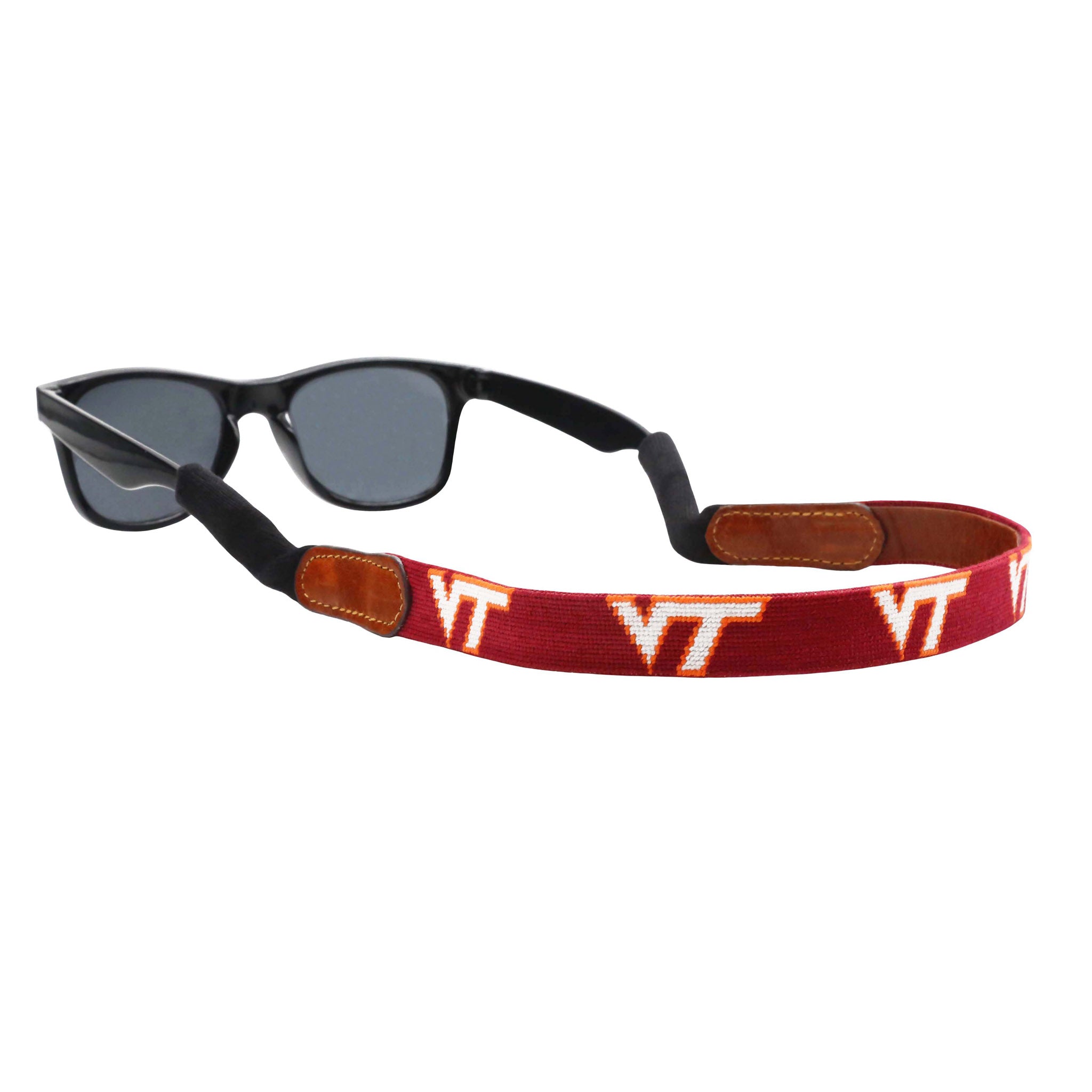 Maroon needlepoint sunglass strap featuring the Virginia Tech logo stitched in orange and white, with leather backing and cotton wrapped connectors for secure wear