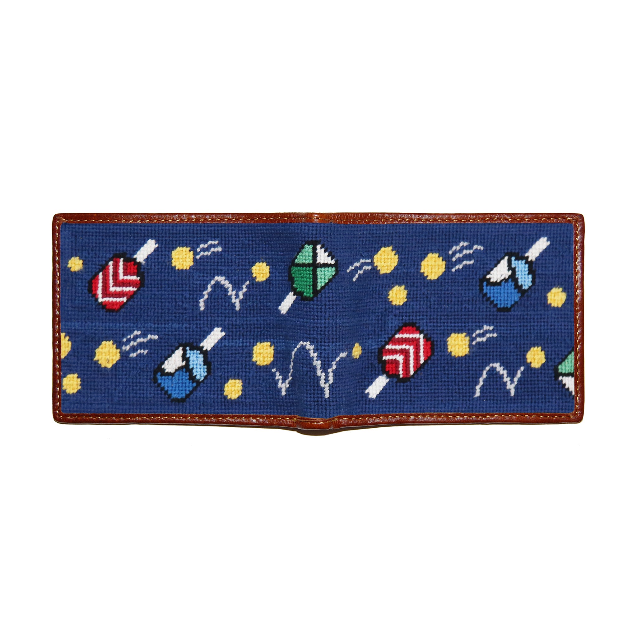 Wacky Pickleball needlepoint bi-fold wallet in classic navy with chestnut leather trim, shown from secondary angle showing interior needlepoint.