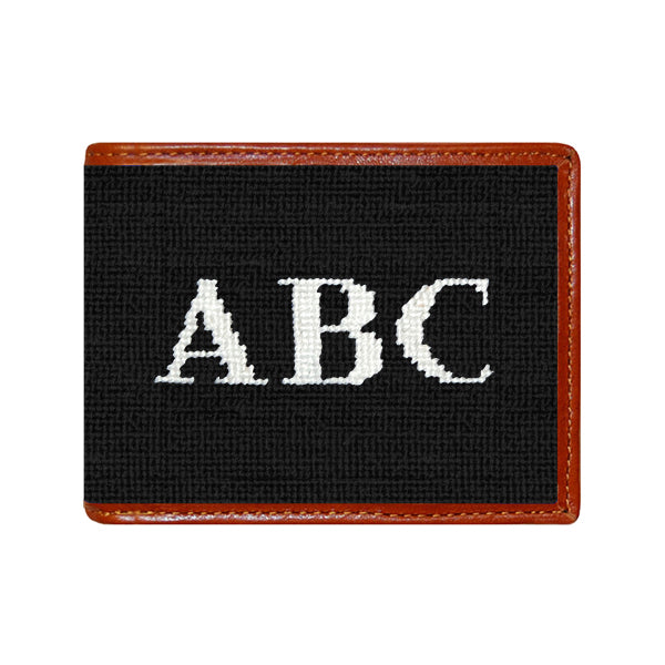Blueberry block monogram needlepoint bi-fold wallet with brown leather trim, shown from primary angle.