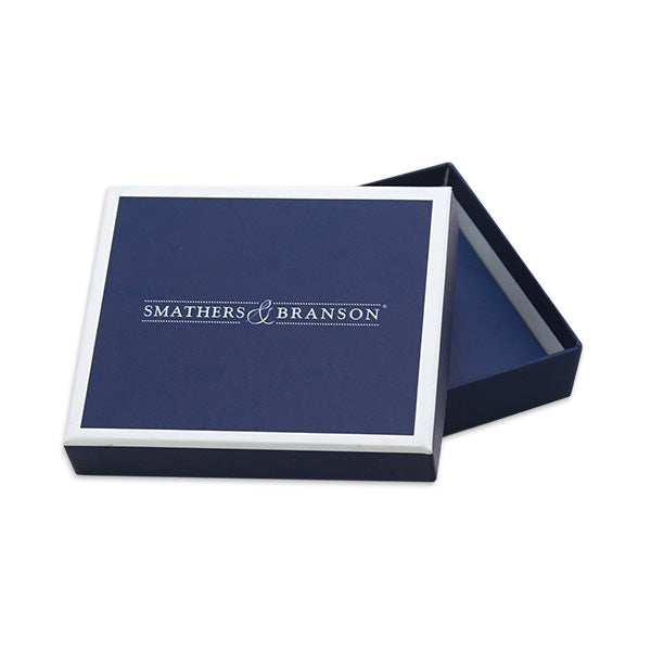 Rectangular gift box with dark navy lid and base, white trim around top edge; lid stamped with ‘Smathers & Branson’ in white text, interior spacious to hold a bi‑fold wallet or luggage tag — outside dimensions approx 5 1⁄8″ × 4 7⁄16″ × 1 1⁄4″