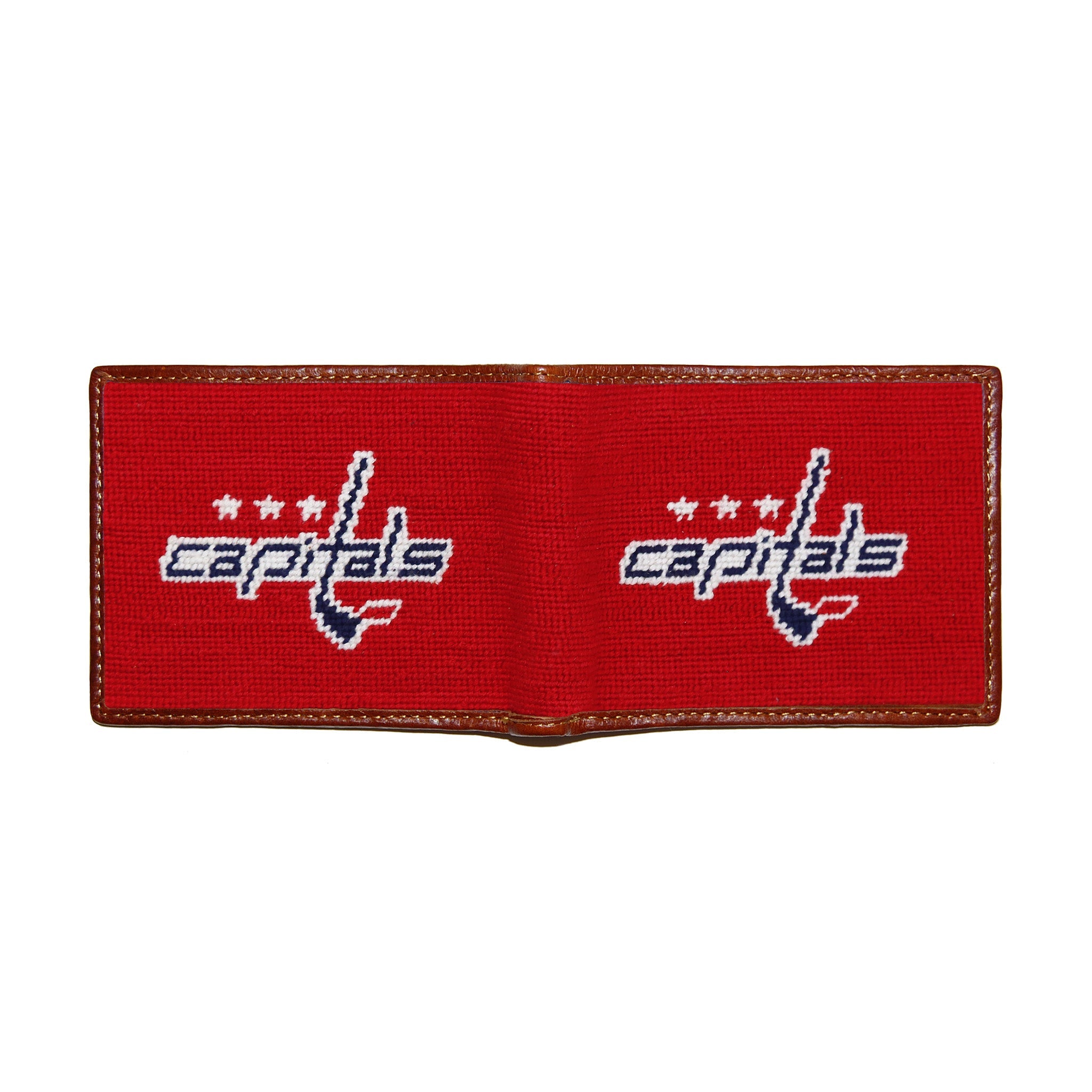 Washington Capitals red, white, and blue needlepoint bi-fold wallet open to show both sides of the white “Caps” logo needlepoint design with brown leather trim.